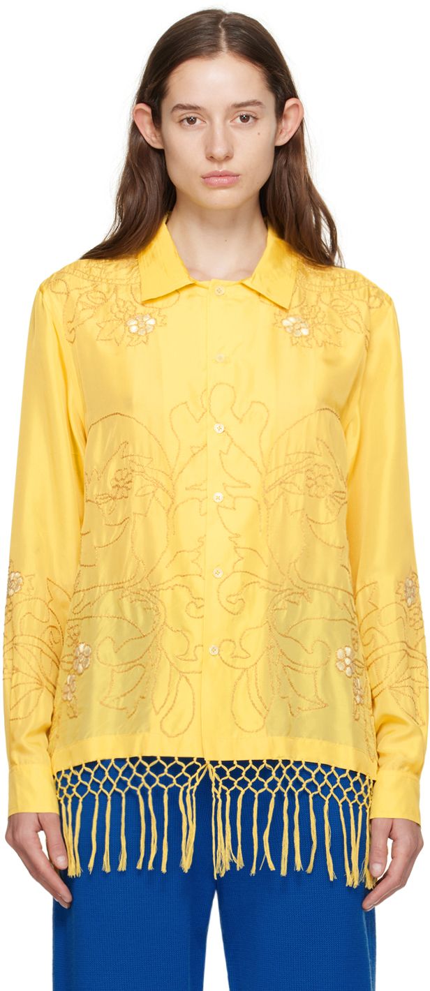 Plain-woven silk shirt. Metallic floral embroidery throughout. · Spread collar · Button closure · Fringe at hem · Single-button barrel cuffs · Twin pleats at back yoke Each item is unique. Please note that coloration and finishings may vary. This item is part of a limited run of 66. Supplier color: Yellow Spring Workwear Shirt Embellished, Elegant Button-up Embellished Blouse, Elegant Embellished Button-up Blouse, Formal Long Sleeve Tops With Embroidered Cuffs, Designer Silk Blouse With Spread Collar, Elegant Tops With Embroidered Cuffs, Formal Long Sleeve Blouse With Embroidered Cuffs, Elegant Embellished Spring Shirt, Designer Embroidered Shirt For Spring