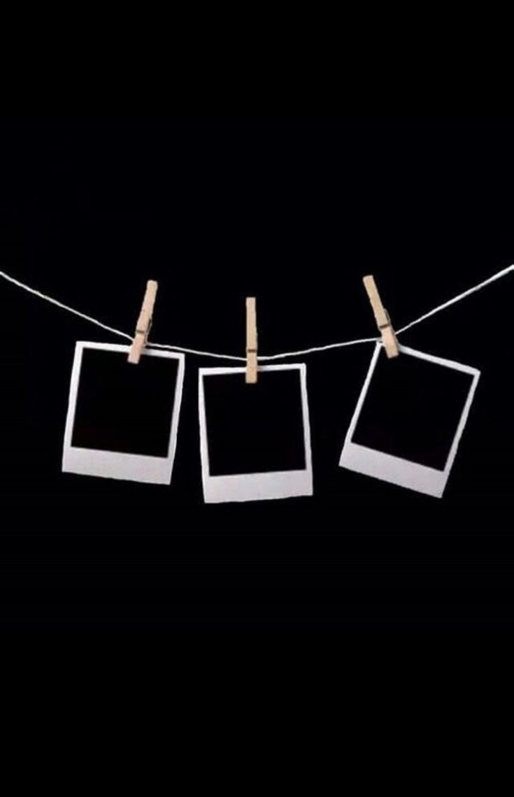 three polaroid frames hanging on a clothes line with clothes pins in front of them