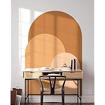 a room with a table and chairs near a wall that has circles on the walls