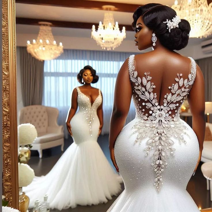 a woman in a wedding dress looking at herself in the mirror with another woman standing behind her