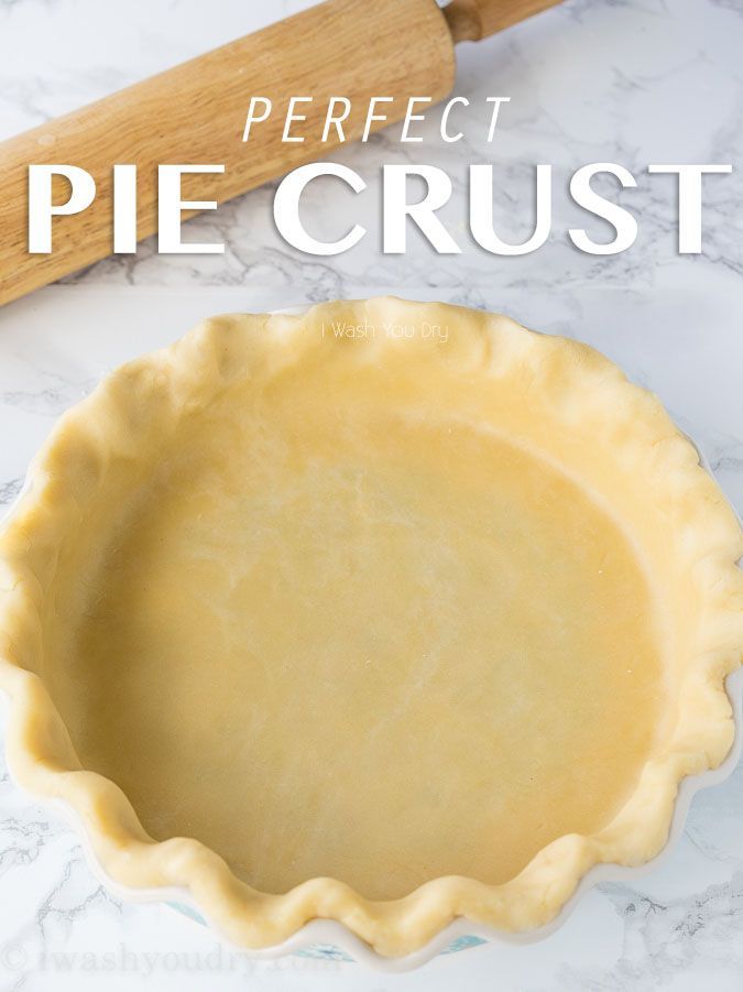 a pie crust sitting on top of a counter next to a rolling pin with the words perfect pie crust