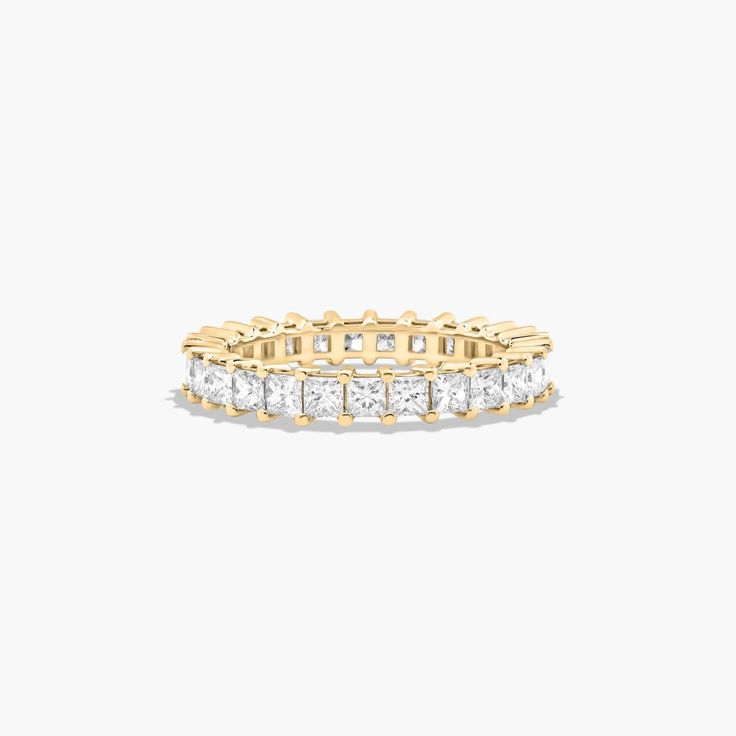 This timeless eternity ring features the boldness and intense sparkle of princess cut diamonds. A classic, tailored shared prongs setting allows the maximum amount of the diamonds surface to show. *Number of diamonds and carat total weight will vary depending on ring size. Princess Cut Gold, Yellow Sapphire Rings, Rings Mens Wedding Bands, Classic Wedding Rings, Platinum Wedding Rings, Pink Sapphire Ring, Round Cut Engagement Rings, Men Diamond Ring, Gold Pearl Earrings