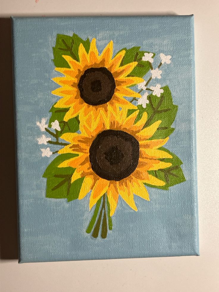 a painting of two sunflowers on a blue background