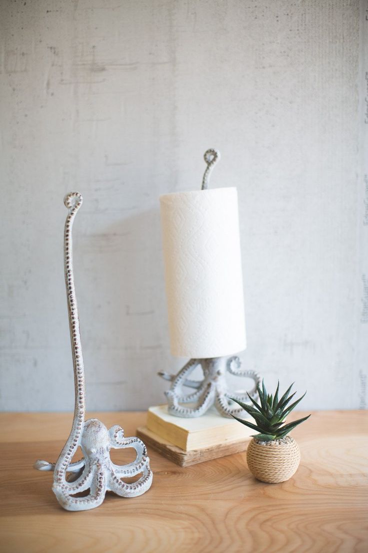 an octopus lamp next to a pineapple on a table