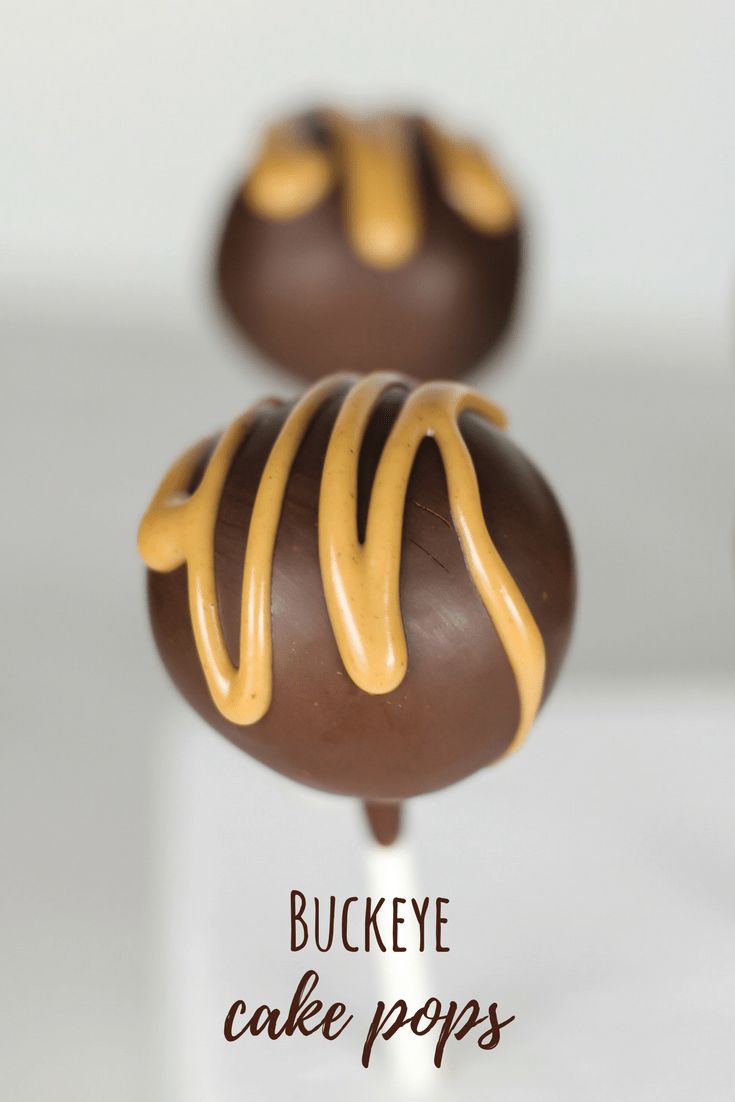 two chocolate covered cake pops with caramel drizzled on top and the words buckeye cake pops above them