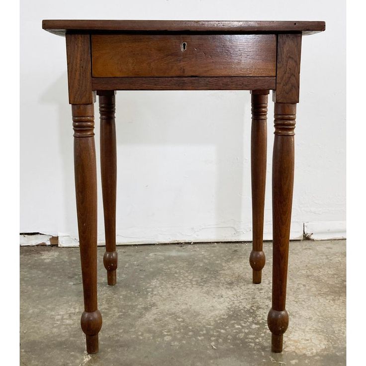 Antique handmade wood side table with single drawer. Simple classic shape with a beautiful patina, turned legs and carved ball feet. Drawer features decorative brass keyhole but no key. No knob. Interior drawer measures 13" x 13" square.  Vintage age wear. Repaired crack to top. Sturdy construction. No key, no knob to drawer. Wood Night Table, Antique Side Table, Side Table With Drawer, Wood Side Table, Vintage Side Table, Wooden Side Table, Antique Wood, Antique Table, Side Table Wood