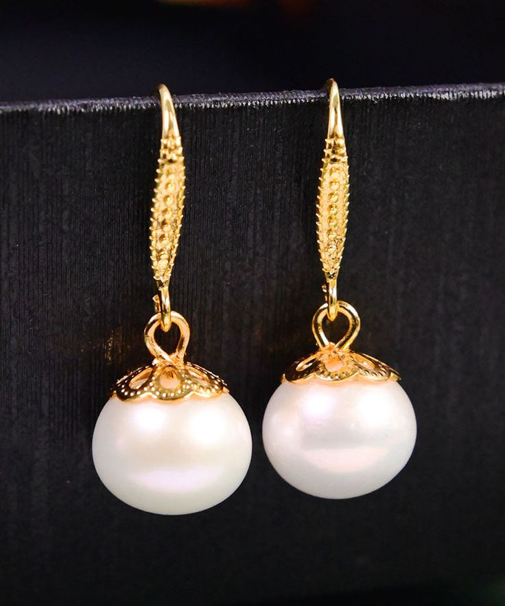 Women White 14K Gold Pearl Ball Drop EarringsMade of fine 14K Gold Pearl.Measurement: 3cm/1.17" * 1.2cm/0.468". Matches easily with daily hairstyle, dresses & Shirts Grape Skewers, Ball Drop Earrings, Daily Hairstyles, Ball Drop, Fashion White, Gold Pearl, Skewers, Women's Earrings, Womens Shirts