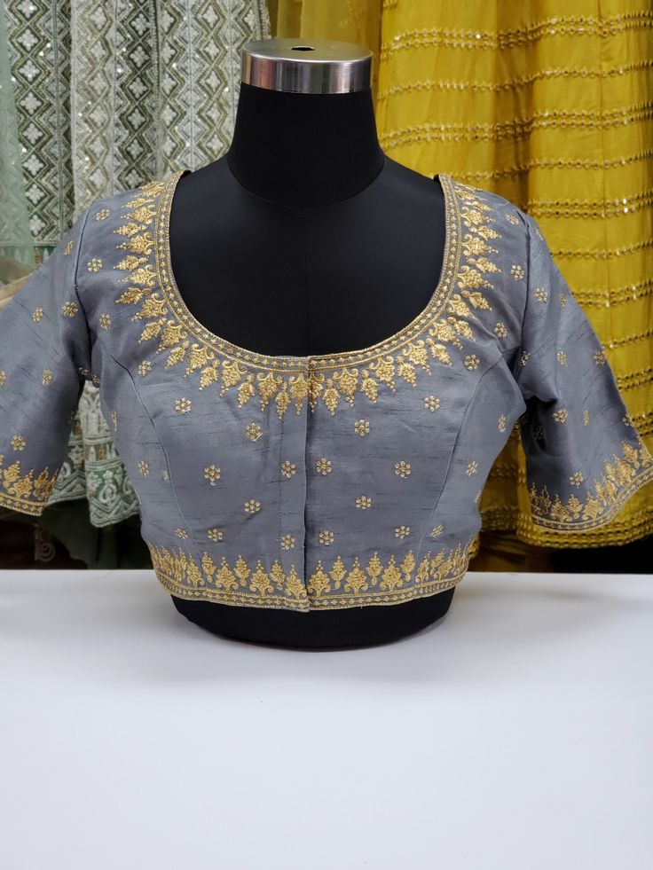 Fancy raw silk blouse with gold embroidery Blouse has 2 inch margins on each side to make it bigger Ready to ship Online only Silk Embroidered Top For Festive Reception, Festive Silk Embroidered Top For Reception, Anarkali Top With Floral Embroidery For Receptions, Dola Silk Blouse For Reception And Transitional Season, Chanderi Blouse For Reception, Transitional Season Chanderi Blouse For Reception, Silk Top With Floral Embroidery For Reception, Chinon Blouse With Traditional Drape For All Seasons, Art Silk Tops With Traditional Drape For Reception