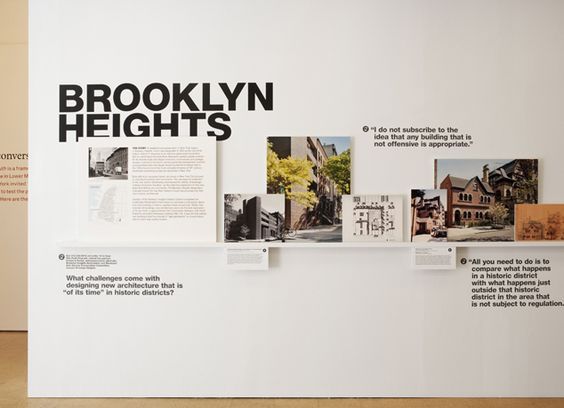 an exhibit with black and white photographs on the wall, including photos from brooklyn heights