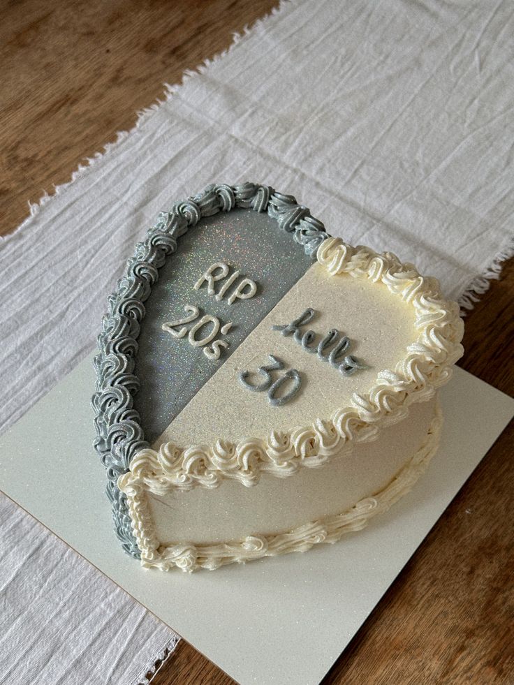 a heart shaped cake sitting on top of a piece of paper next to a napkin