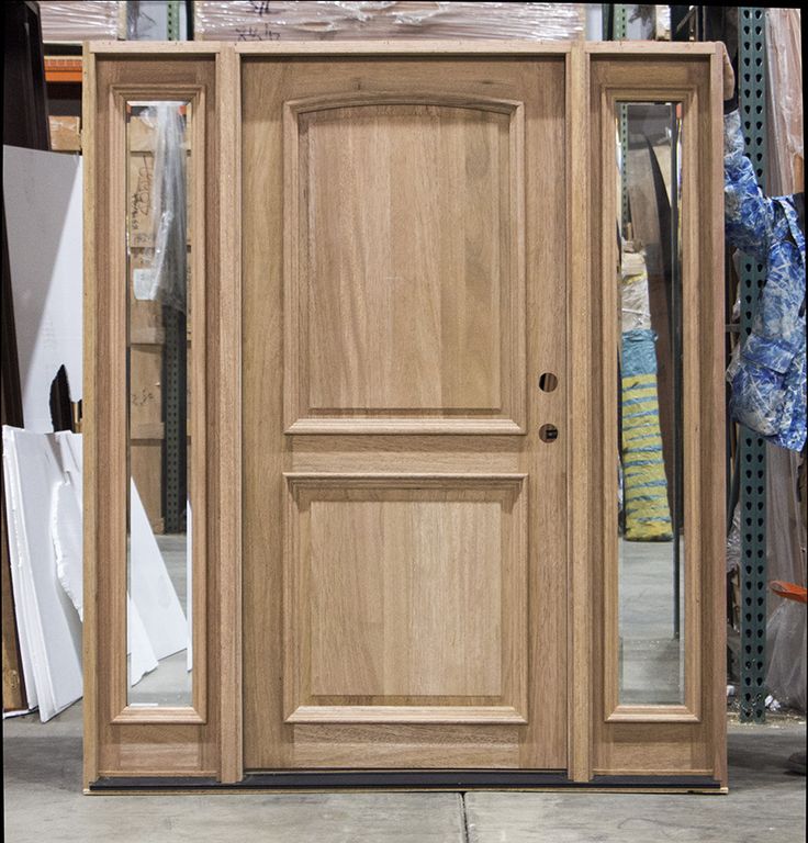 a large wooden door sitting inside of a store