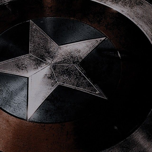 an image of a star on the side of a captain america shield with black and white paint