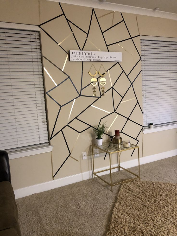 a living room wall decorated with geometric shapes