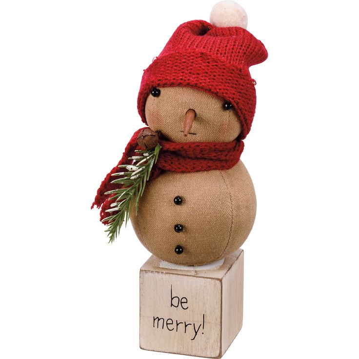 a snowman with a red hat and scarf on it's head is sitting on a block that says be merry