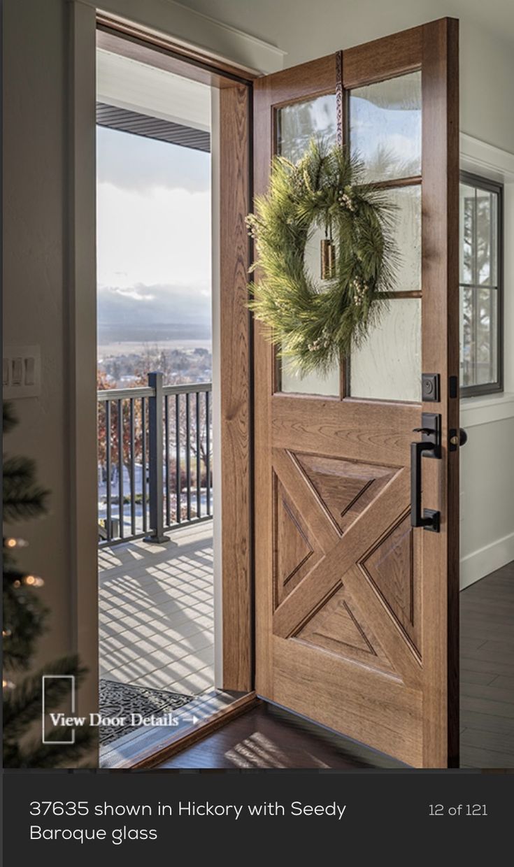 a wooden door with a wreath on it