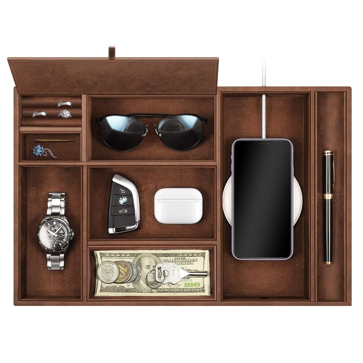 an open wooden case with sunglasses, money and other items in it on a white background