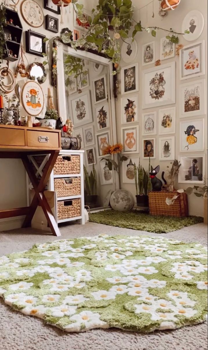 a room with many pictures on the wall and a green rug in front of it