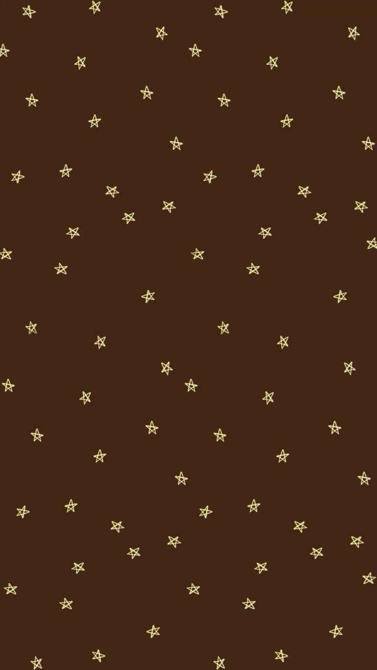 a brown background with gold stars on it