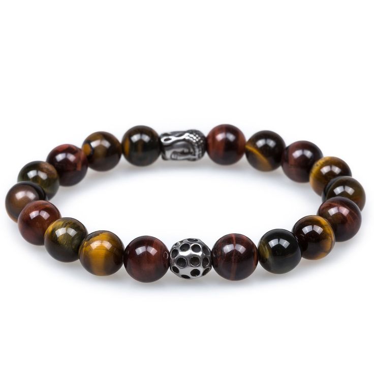 The earth-tone hues featured in OTAA's Tiger's Eye with Lava Stone Bracelet offers an eclectic addition to refined ensembles. Tiger's eye is a chatoyant gemstone with a golden yellow and brown complexion and lustre finish. The yellow and brown stripes of this stone appear to swap complexions when viewed from different angles. Boasting impeccable detail, the silver buddha charm featured in this design was hand-chiselled from rhodium with intricate embossments. Pair the Tiger's Eye with Buddha Bracelet Beads, Buddha Bracelets, Lava Stone Bracelet, Buddha Beads, Onyx Marble, Tiger Eye Beads, Tiger Eye Stone, Marble Stones, Lava Stone