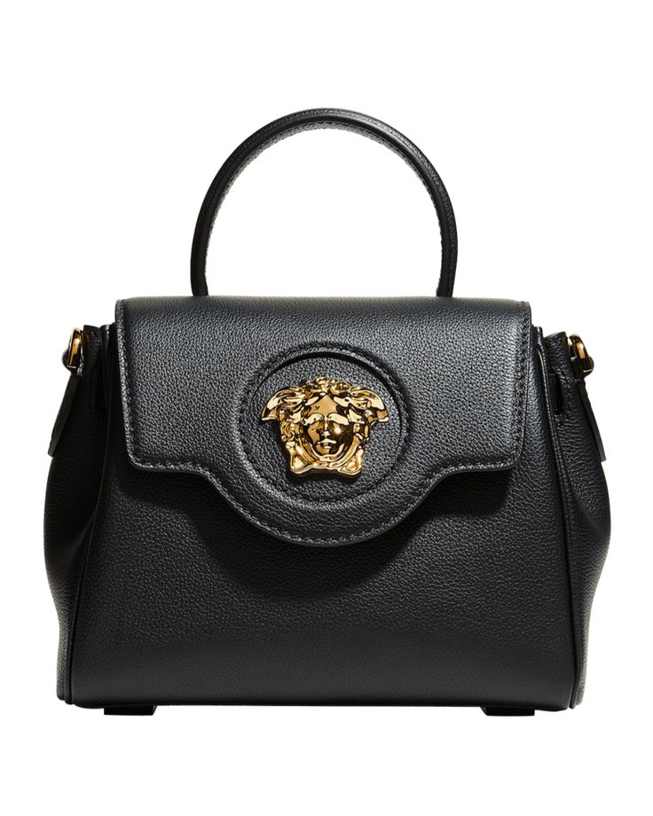 Versace top handle bag in leather. Adorned with a Medusa plaque – the same décor that was discovered on the doors of the brand's first headquarters in Milan Signature tonal Medusa head at front. Rolled top handle, 3" drop Removable, adjustable leather shoulder strap, 18"-19 1/2" drop Chain shoulder strap, 11" drop Slouchy silhouette can be styled on the wrist or across the shoulder Flap top with magnetic snap closure. Interior, slip pocket. Approx. 6.7"H x 7.8"W x 3.9"D... Bottega Veneta Arco, Versace Top, Versace Bag, Suede Handbags, Medusa Head, Womens Designer Handbags, Versace Bags, Gold Handbags, Small Handbag