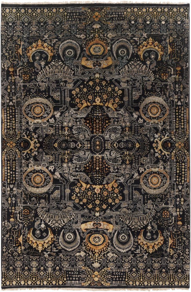 a black and gold rug with an intricate design