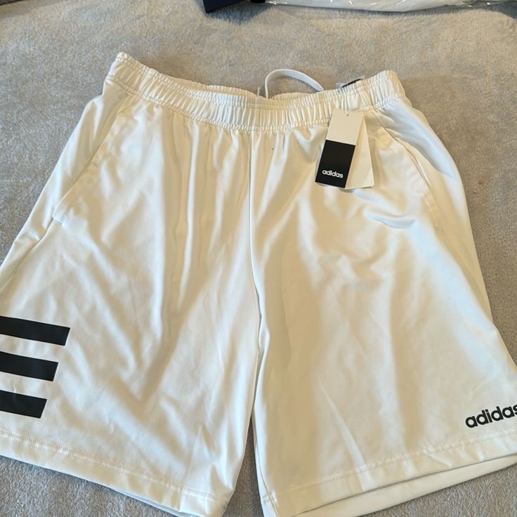 New With Tag White Shorts With Three Stripes For Spring, White Three Stripes Shorts For Spring, Adidas White Athletic Shorts With Built-in Shorts, White Athletic Shorts With Three Stripes For Summer, Adidas White Cotton Athletic Shorts, Adidas Casual White Shorts, Adidas White Casual Shorts, White Cotton Adidas Shorts, Adidas Shorts Mens