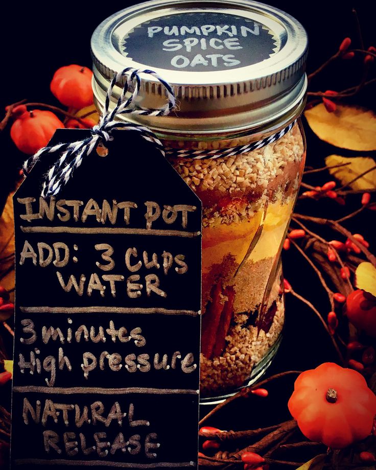 a jar filled with lots of food next to a sign