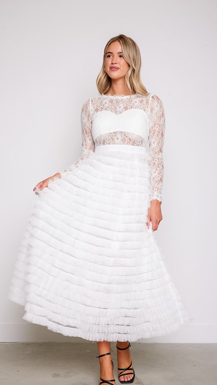 Experience the magic and allure of our Olivia Layered White Lace Tulle Dress, where timeless elegance meets modern romance. Whether you're walking down the aisle, attending a formal event, or celebrating a special occasion, this dress will make you feel like the epitome of grace and beauty. 78747 D8-2 Spring Gown With Sheer And Fitted Bodice, Fitted Organza Midi Dress For Formal Occasions, Formal Fitted Organza Midi Dress, Fitted Lace Ball Gown For Spring, Elegant Evening Dress With Lace Bodice And Organza, Elegant Spring Ball Gown For Debutante Ball, Elegant Party Gown With Illusion Neckline, Elegant Ball Gown For Debutante Ball In Spring, White Illusion Neckline Dress For Prom