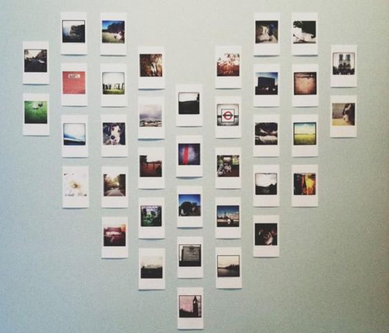 a white wall with many pictures on it