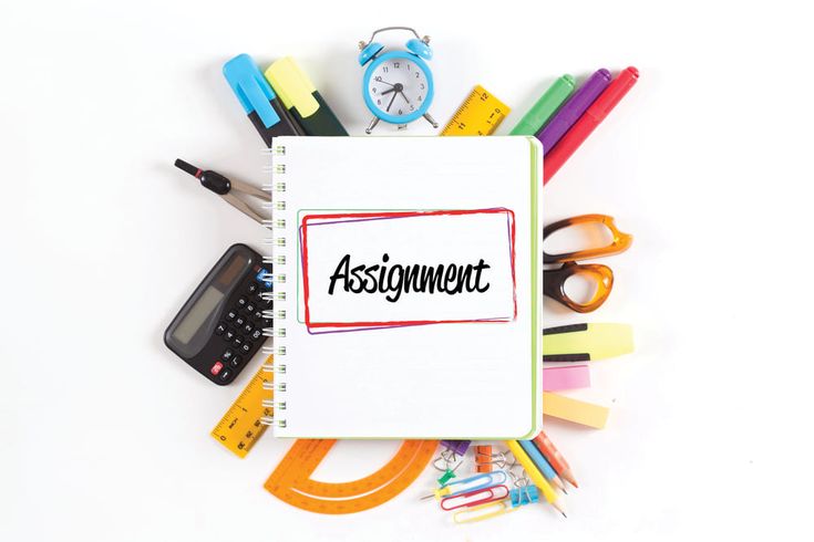 an assignment book surrounded by school supplies on a white background with the word assignment written in red