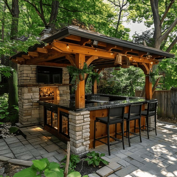 an outdoor bar with stools and barstools in the middle of a garden