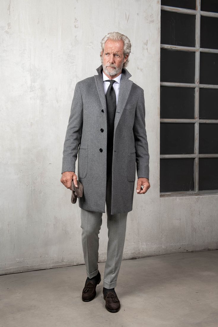 Our classic grey overcoat is crafted from luxurious and soft Loro Piana wool and is an essential formal outerwear piece that will show great versatility when worn over any suit. Composition: 100 % Loro Piana wool, "Capolavoro" collection - 570 gsmColor: GreyHalf canvas constructionNatural shoulders (no padding)"Barchet Classic Wool Blazer For Business Trips, Business Wool Long Coat With Pockets, Business Long Wool Coat With Pockets, Tailored Wool Coat With Concealed Placket For Semi-formal Occasions, Formal Pea Coat With Notch Lapel And Concealed Placket, Luxury Single Breasted Wool Coat For Business, Luxury Single-breasted Wool Coat For Business, Gray Outerwear With Concealed Placket For Work, Elegant Semi-formal Wool Coat With Lapel Collar