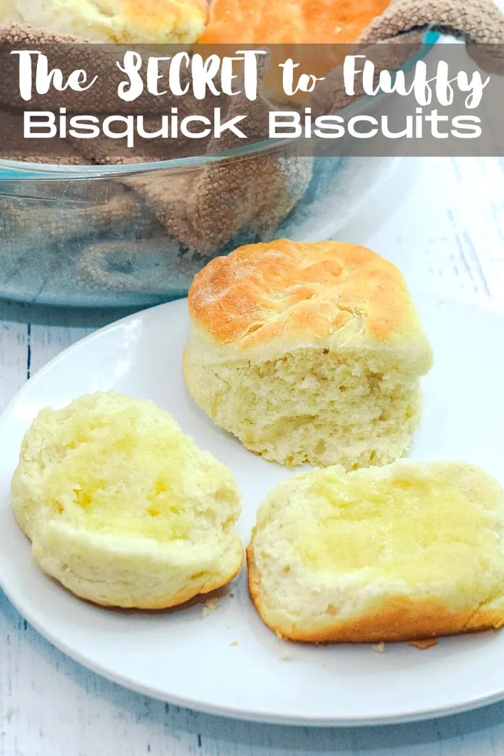 the secret to fluffy biscuits on a white plate next to a bowl of biscuits