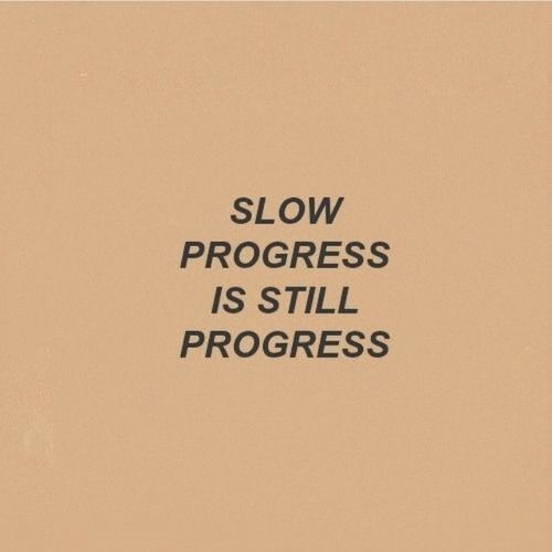 the words slow progress is still progress written in black on a beige background with an orange border