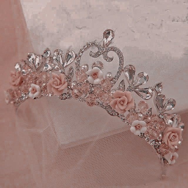 a tiara with pink flowers on it