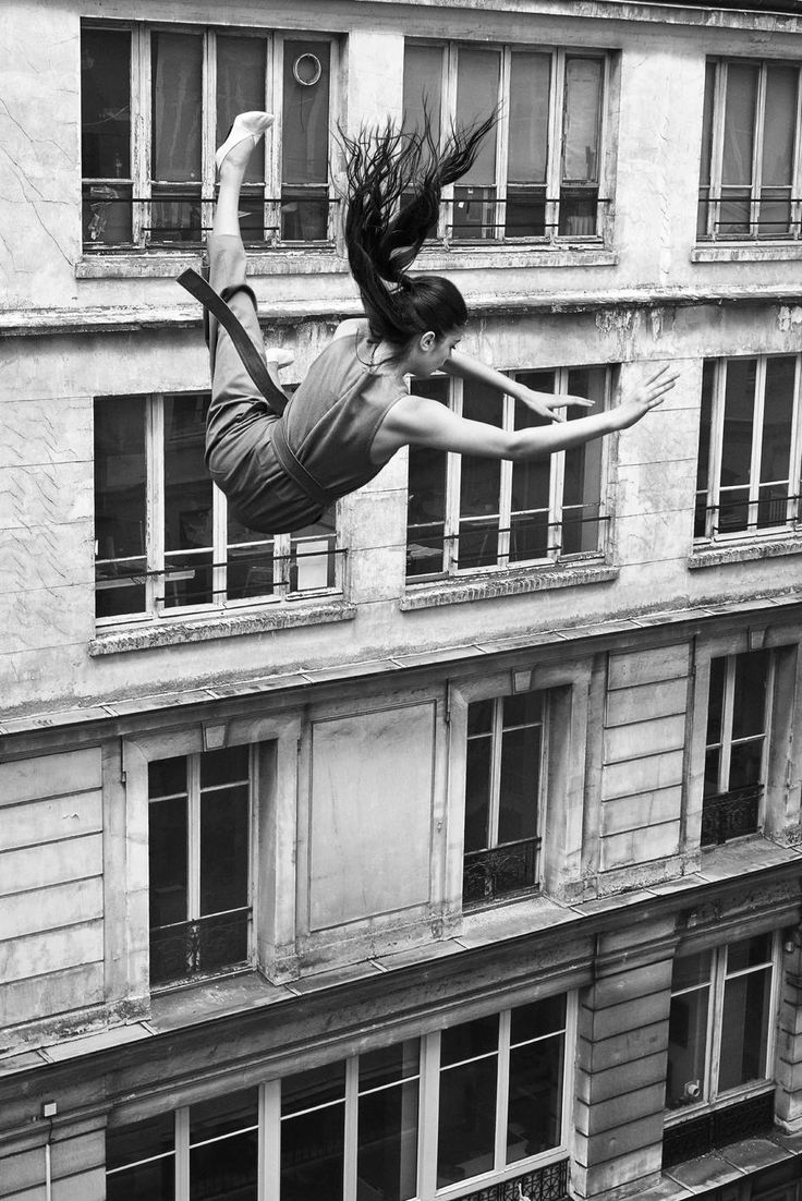 black and white photograph of a woman in the air