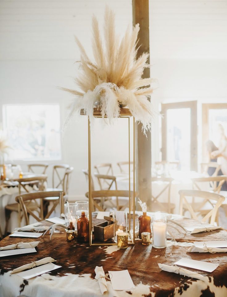 the table is set up with place settings for guests to sit down and enjoy their meal