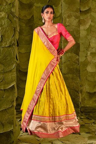 Passionfruit yellow lehenga with gold zari beaten hand embroidery. Paired with a pink embroidered blouse and fan pleat trimmed embroidered dupatta. - Aza Fashions Yellow Cutdana Sets For Reception, Fitted Yellow Pre-draped Saree With Pallu, Festive Yellow Raw Silk Pre-draped Saree, Yellow Cutdana Sharara For Reception, Yellow Tissue Silk Pre-draped Saree For Navratri, Yellow Chanderi Sets For Reception, Yellow Sets With Dori Work For Reception, Yellow Chanderi Saree For Reception, Yellow Gota Work Sets For Reception