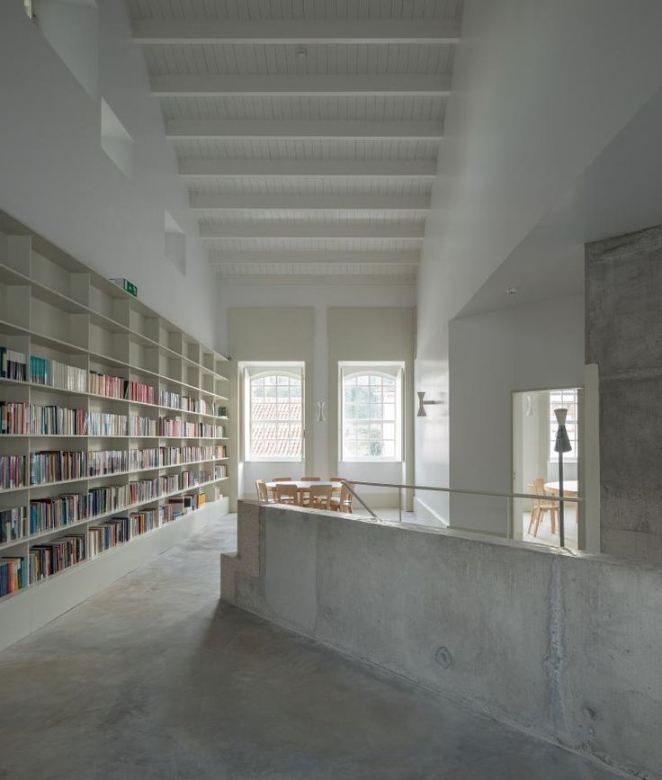 an empty library with bookshelves and tables