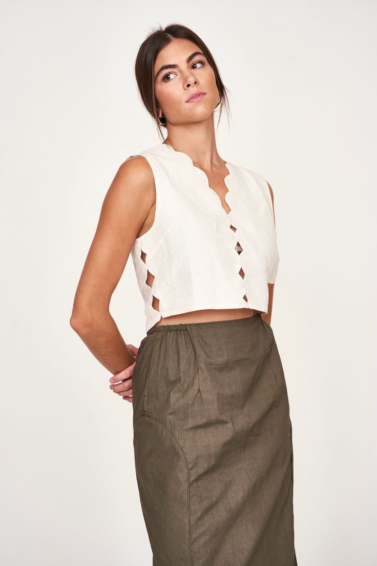 Sleeveless cropped top Scallop cutout detailing Side button closure Lined in cotton 71% linen, 29% cotton Made in India Handloom Fabric, Pajama Robe, Sleeveless Crop Top, Cropped Top, Body Size, Sweater Jacket, Spring Fashion, Sweater Top, New Dress