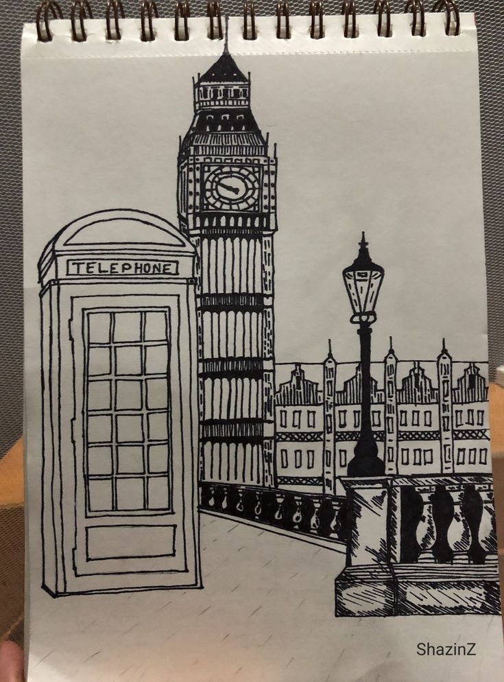 a drawing of the big ben clock tower and telephone booth in london, england on a notepad