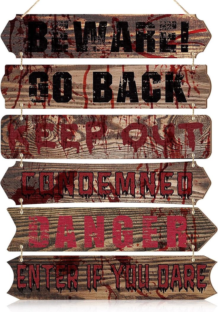 four wooden signs with the words beware, go back, repurposed and danger written on them