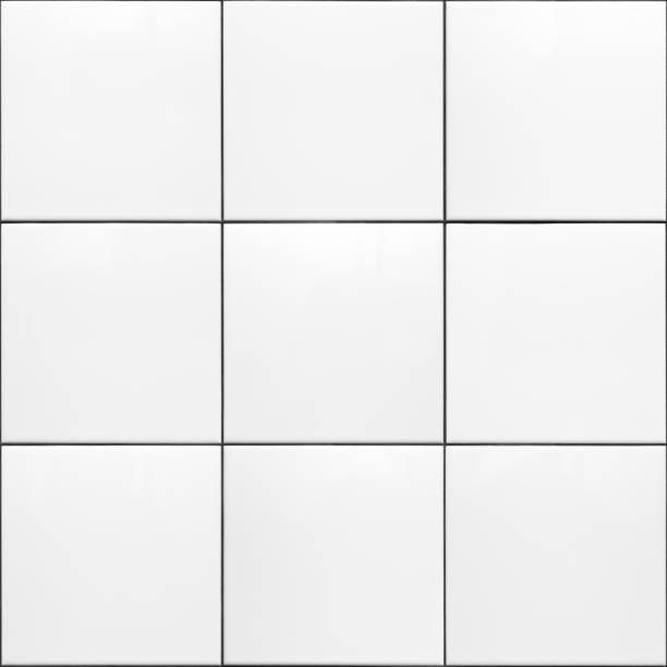 a white tiled wall with black and white squares