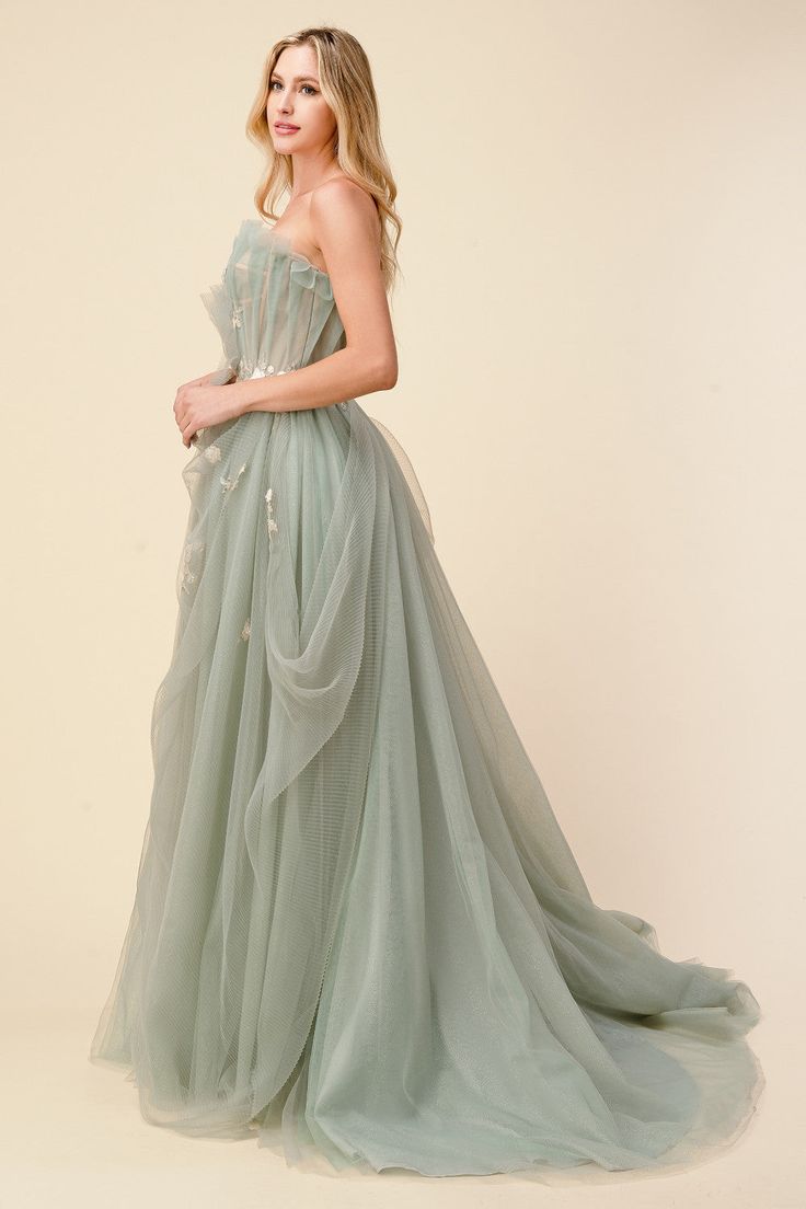 ETA 07/30 What's not to love about this calming sage prom dress with spring garden hues. With delicate blossom details, this Bridgerton inspired sage tulle ball gown is made of beautifully draped plisse tulle that pleats over nude corset bodice. Featuring a regal, plisse tulle at the skirt with under-layers of a subtle sparkle that make this gown truly magical. The bodice has an adjustable corset back to make a great fit for all body types. What makes our Bridgerton Inspired Sage Tulle Ball Gown Sage Prom Dress, Modest Prom Gowns, Andrea And Leo, Tulle Balls, Dress Layered, Tulle Ball Gown, Gowns Prom, Corset Bodice, Ball Gowns Evening