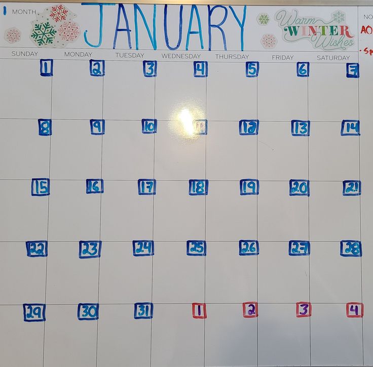 a calendar with blue and red numbers is shown on a white board that says january