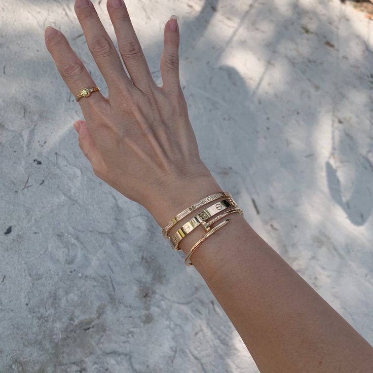 Cartier Love Bracelet Stack Ideas, Cartier Wrist Stack, Stacking Bracelets With Watch, Wrist Jewelry Stack, Gold Bangle Stacking Ideas, How To Layer Bracelets With A Watch, Gold Bracelet Layering, Cartier Love Cuff Bracelet, Bracelet Layering Ideas Gold