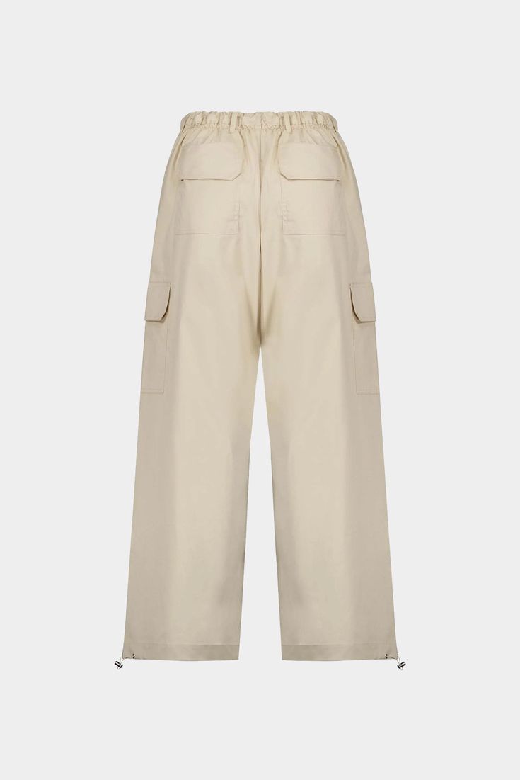 Oversized cargo pant with an elasticized waist, six patch pockets, belt loops, and adjustable toggles at the hem so the wearer can adjust the hem opening as desired. Fit runs true to size Pulls on Made from lightweight stretch fabric Adjustable gathered waist and leg Composition: 68% Cotton, 28% Polyester, 4% Elastane Made in Portugal Baggy Utility Cargo Pants With Elastic Waistband, Utility Parachute Pants With Cargo Pockets, Utility Cargo Pants With Elastic Waistband In Khaki, Utility Khaki Cargo Pants With Elastic Waistband, Utility Cargo Jeans With Elastic Waistband, Beige High-waisted Parachute Pants With Pockets, Utility Wide-leg Cargo Pants With Elastic Waistband, Utility Wide Leg Cargo Pants With Elastic Waistband, Beige High-waisted Cargo Parachute Pants