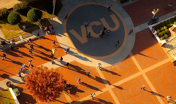 an aerial view of people walking around in the park with vcj written on it