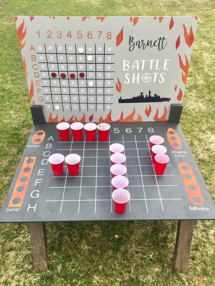 a board game set up with cups on it