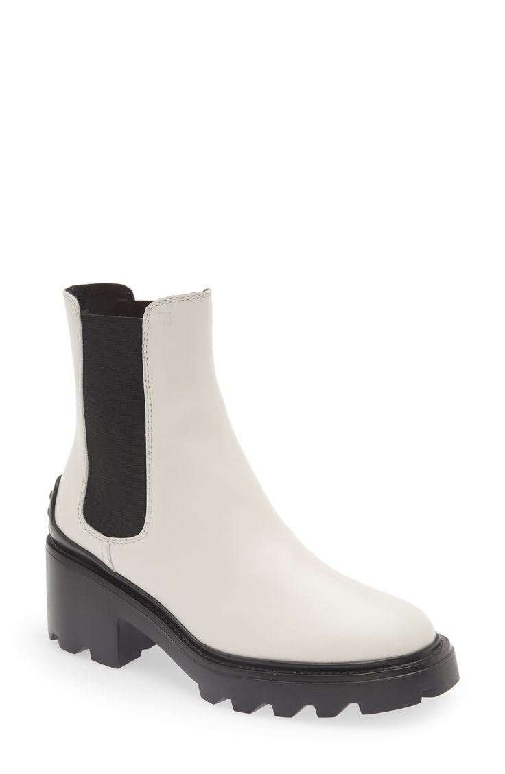 This elevated take on the Chelsea boot is distinguished by a block heel and lugged sole with pebbled tread inspired by the brand's driving shoes. 2 1/4" (57mm) heel (size 38.5) 6" shaft Pull-on style with elastic gore insets Leather and textile upper and lining/rubber sole Made in Italy Women's Designer Shoes Chic Boots With Lug Sole For Work, Chic Workwear Boots With Lug Sole, Modern Moto Boots With Lug Sole, Workwear Heeled Boots With Lug Sole In Medium Width, Workwear Heeled Boots With Lug Sole, Calf Leather Platform Boots With Lug Sole For Work, Modern Platform Boots With Lug Sole For Workwear, Modern Workwear Boots With Lug Sole, Chic Boots With Lug Sole And Block Heel